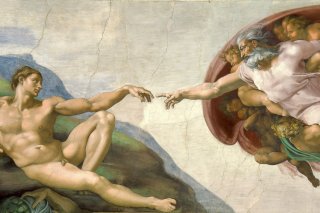 Obraz stvoření Adama od Michelangela na stropě Sixtinské kaple.
